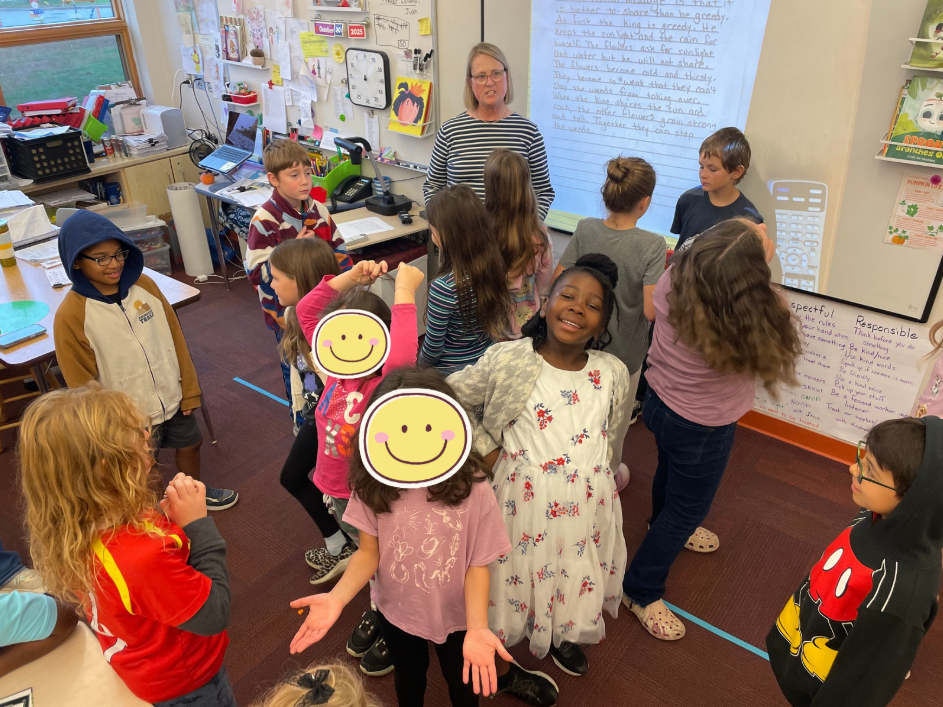 students in 2 circles smiling and talking