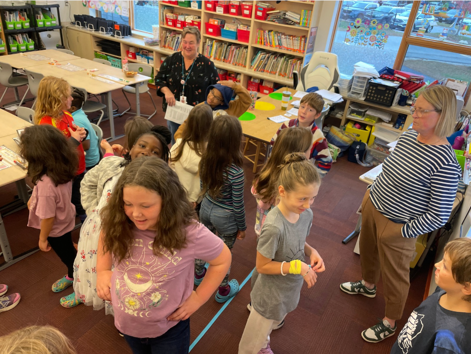 students standing in a circle talking