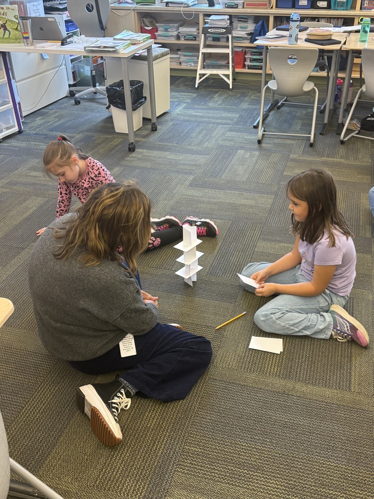 3 girls building a tower