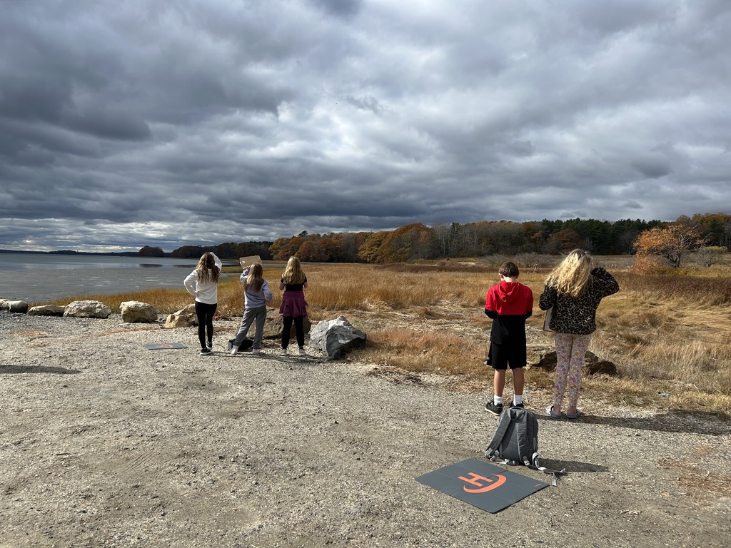 Students flying drones at Wharton's Point.