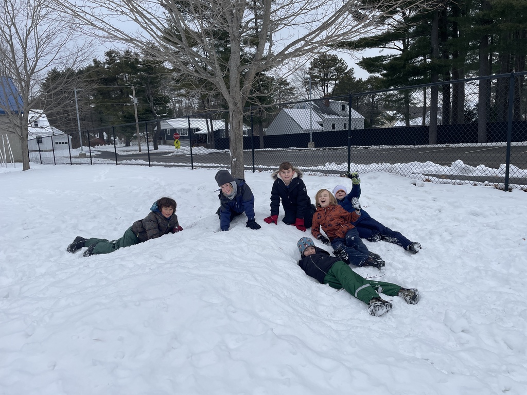 kids having fun on a snow bank