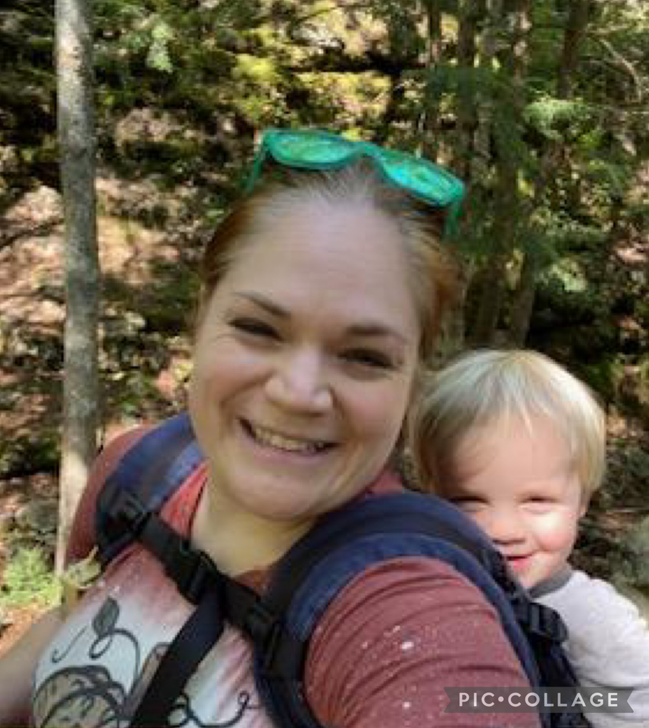 Woman hiking with baby on back