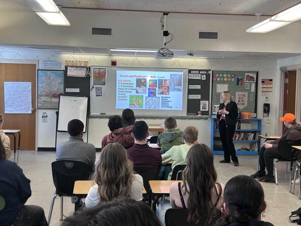 BHS teacher giving a presentation to a group of 8th grade BJH students.