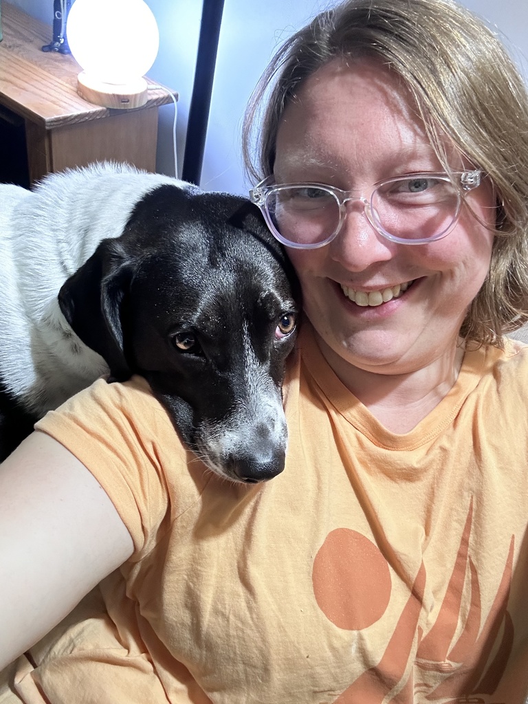 Woman smiling with her dog