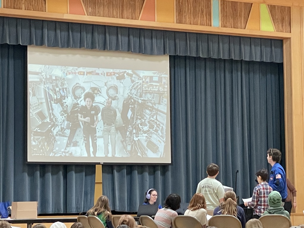 student asking the astronauts a question