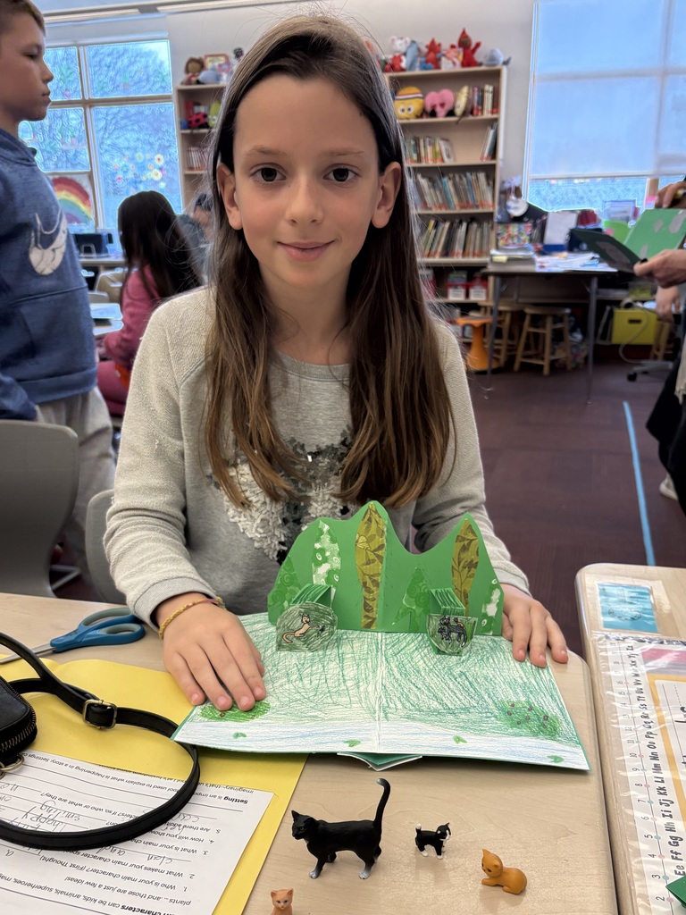 student showing off their pop-up page