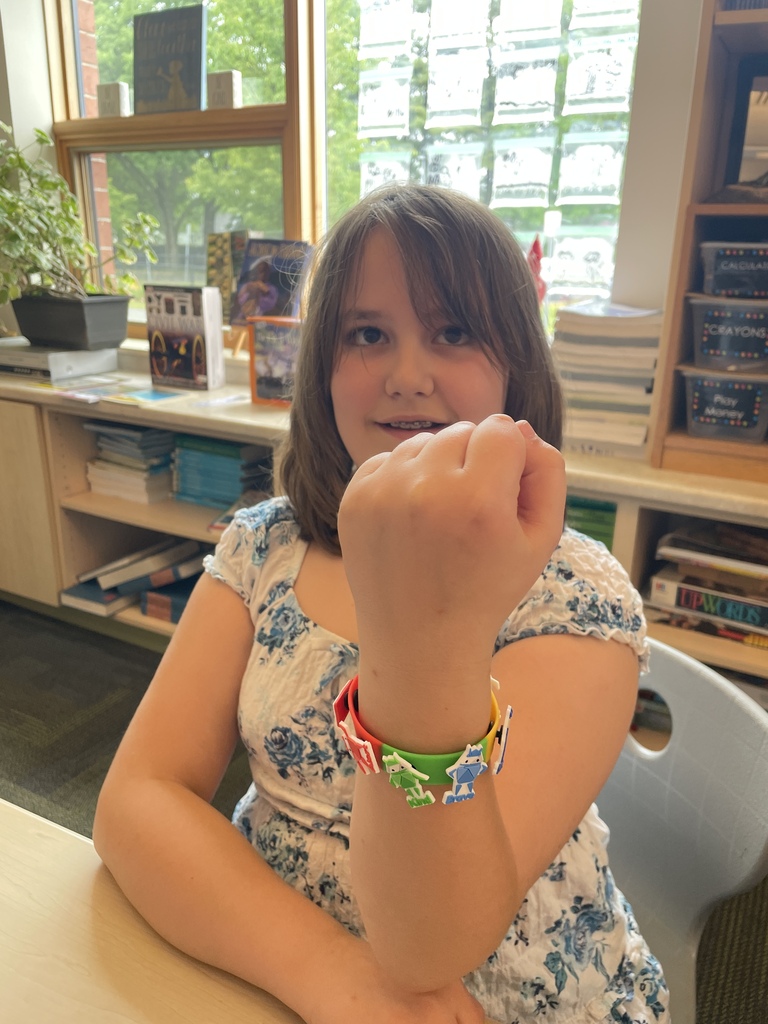 girls showing off her new bracelet