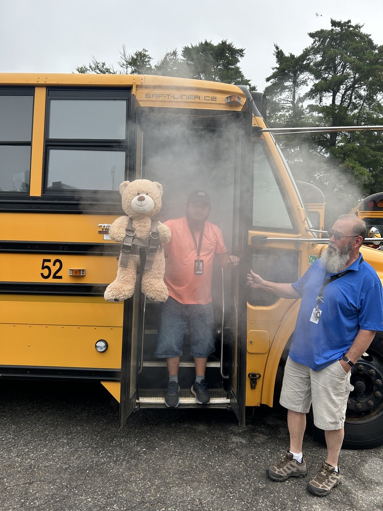 Bus and Drivers with smoke and stuffed bear