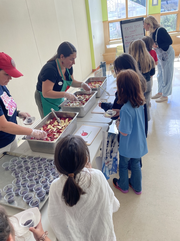 students in line to get apples