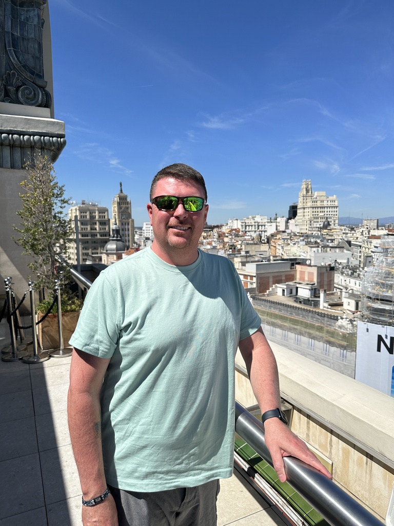 Man in sunglasses on a balcony