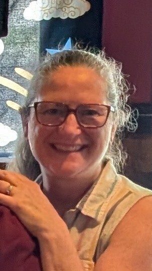 Woman with glasses smiling