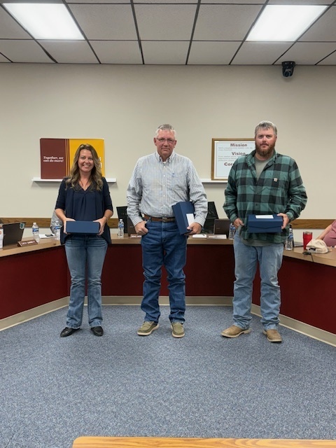 Picture of outgoing board members. Brandy Hansen, Brad Mortensen and Derek Windsheimer.