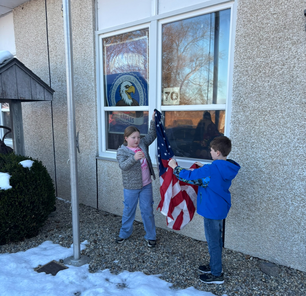 Students raising the flag.