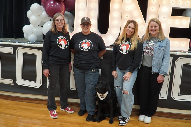 June, The Comfort Dog with INTERQUEST members and her handler.