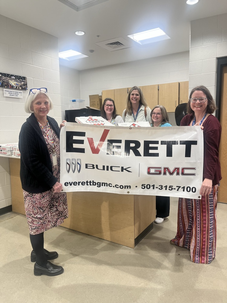 Teachers with Everett sign