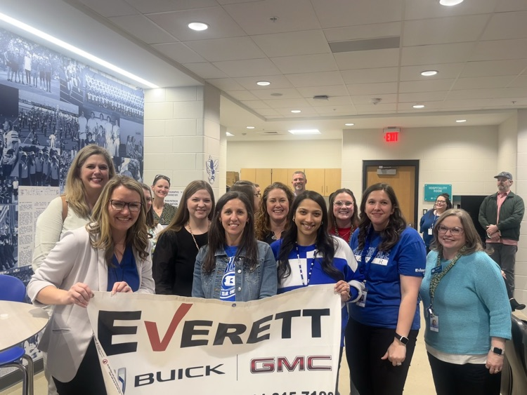 Teachers with Everett sign