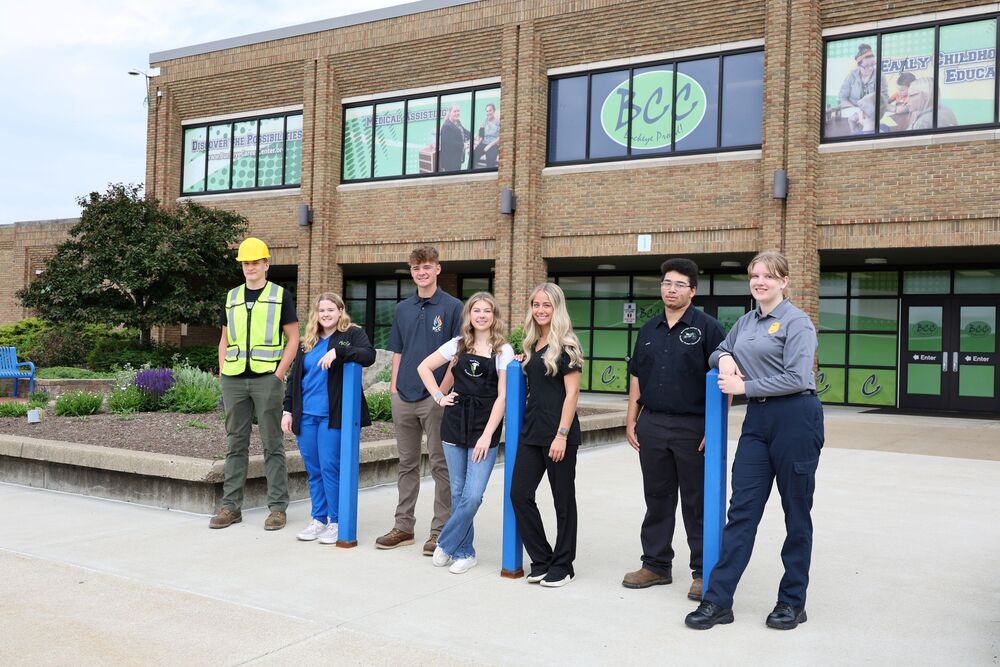 students in front of building