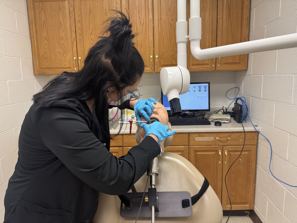Dental Assisting students using  a X-ray machine. 