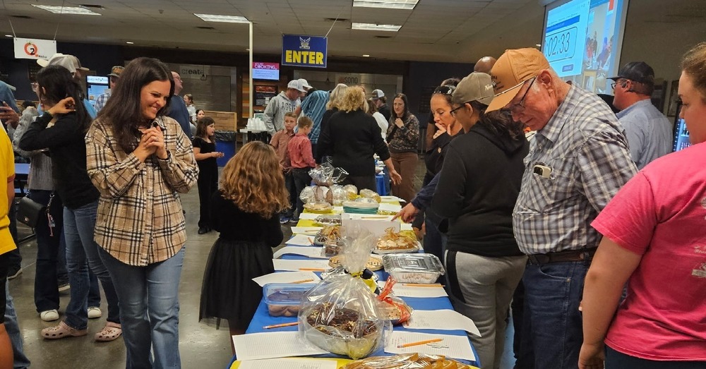 Attendees looking at desserts