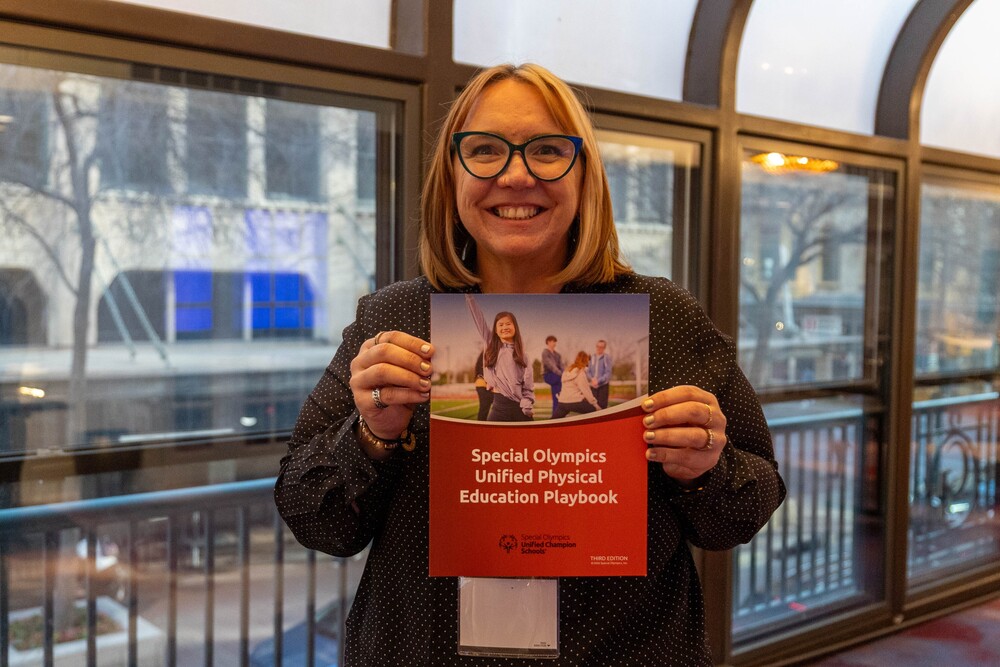 person posing with a book