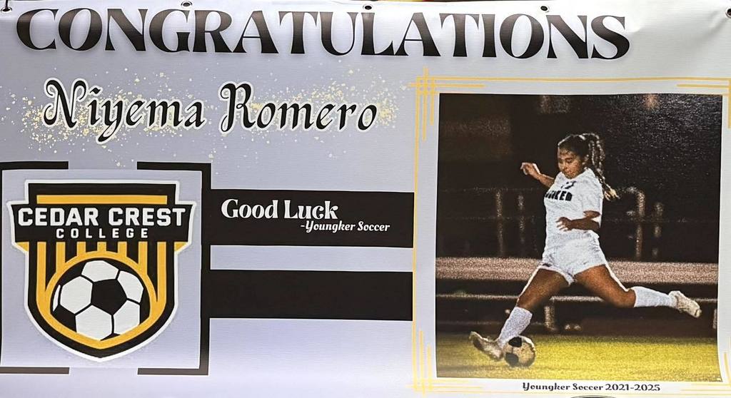 Printed banner congratulating Niyema Romero