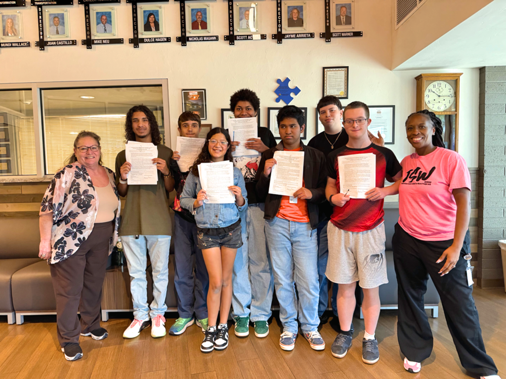 tsw kids pose with their contracts