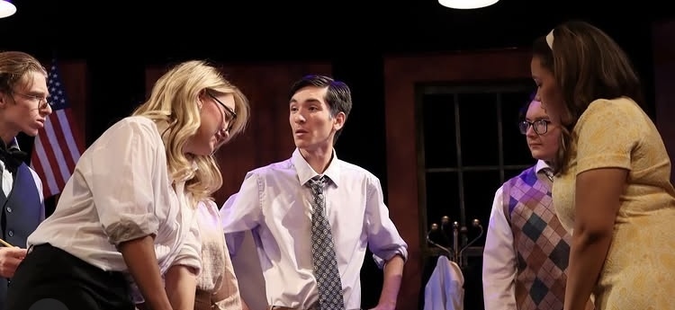 Student actors on stage