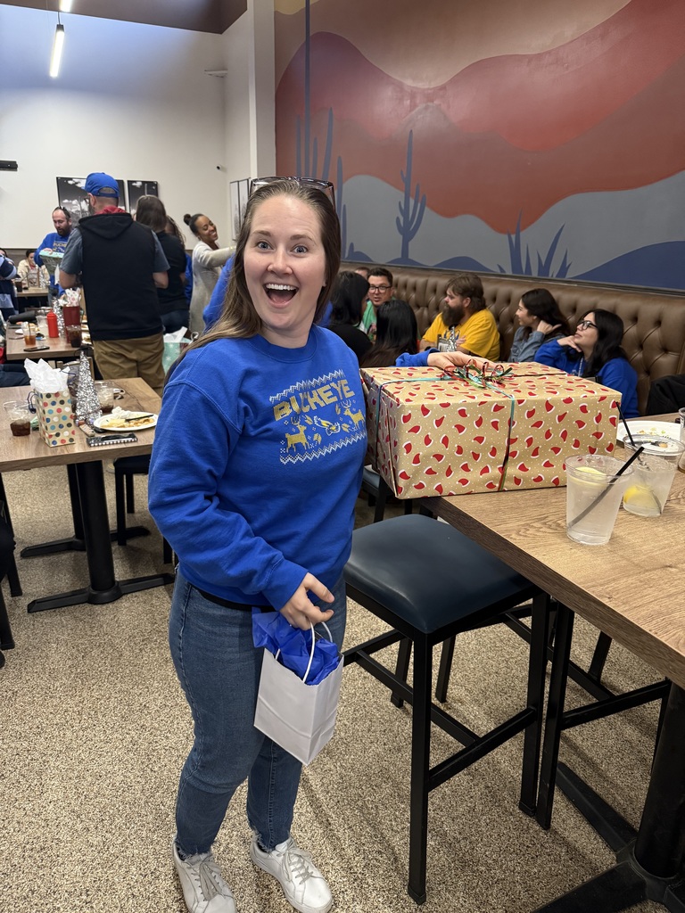 teacher posing with gift