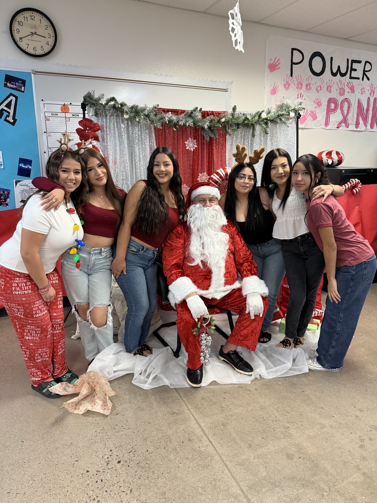 students posing with Santa