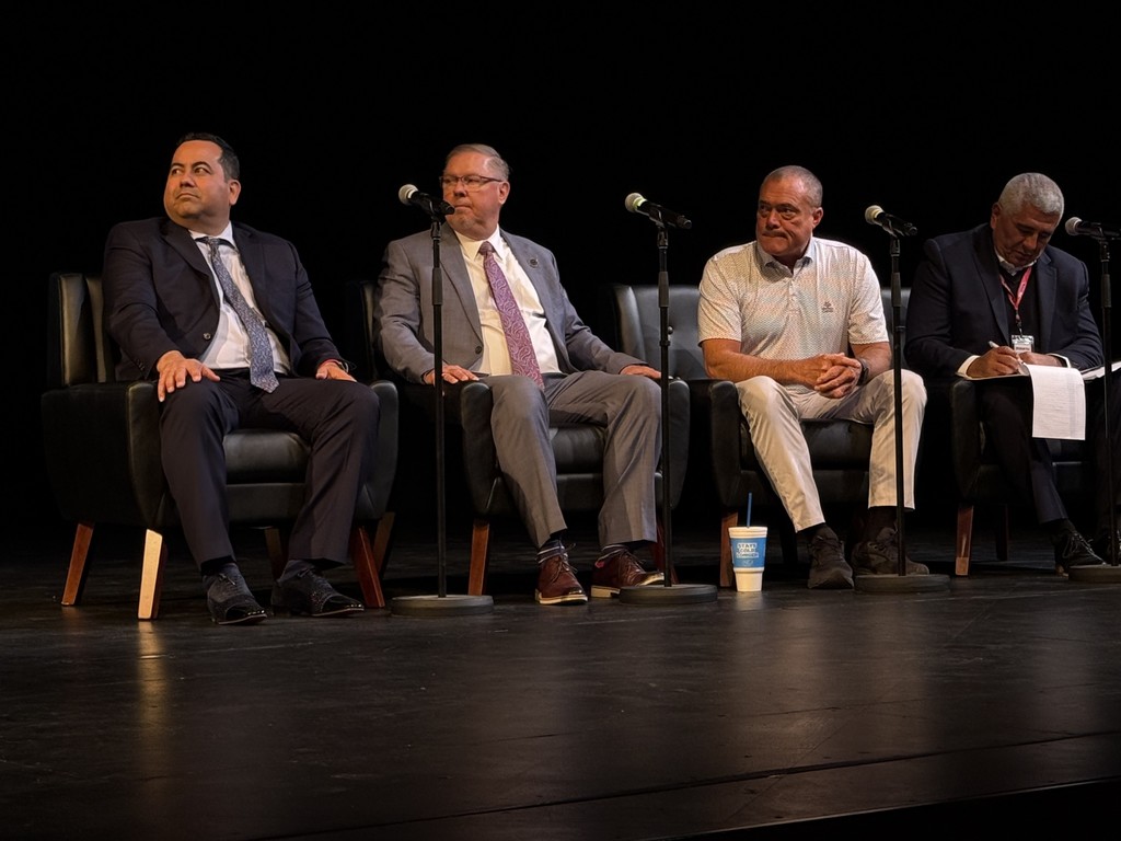 men posing in group photo