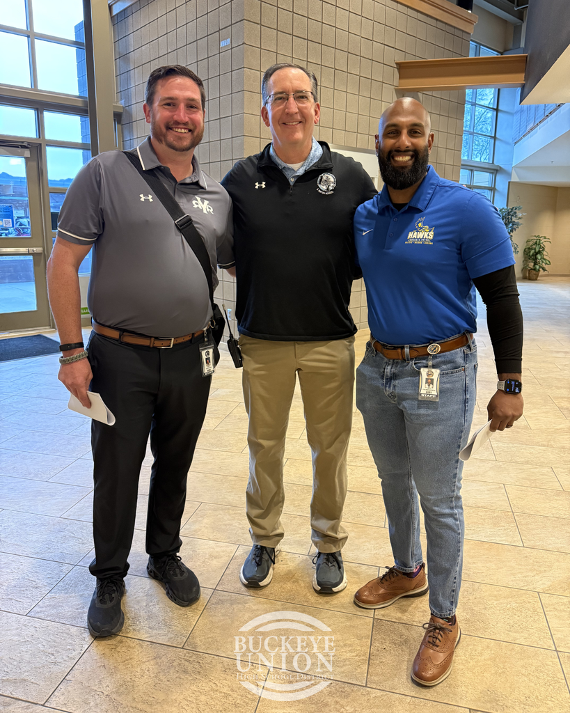 men posing in group photo