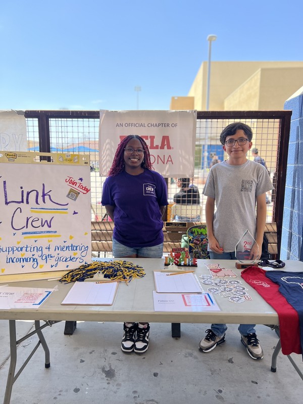 Students standing at Link Crew Table