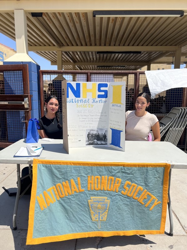 Students sitting at National Honor Society Table