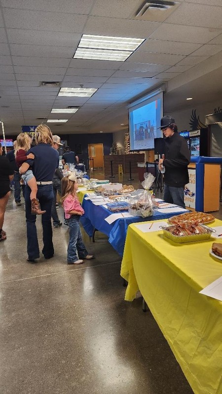 Fundraiser attendees looking at desserts