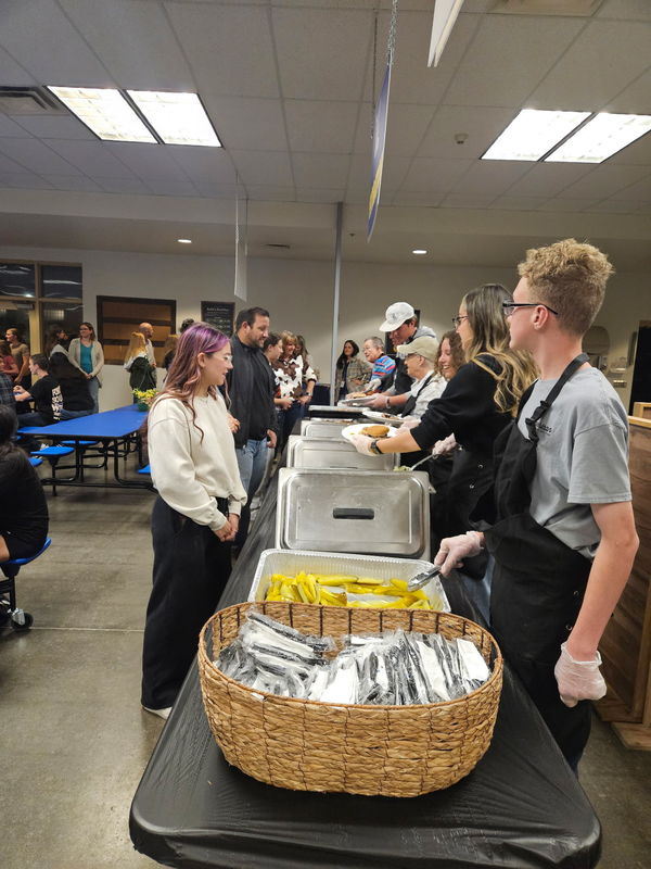 Fundraiser attendees standing in line for food