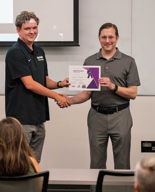 Cooper receiving his award