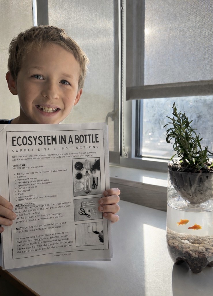 BE 3rd-grader with  an ecosystem in a bottle