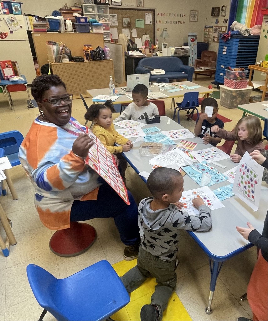 Preschool students working at their table
