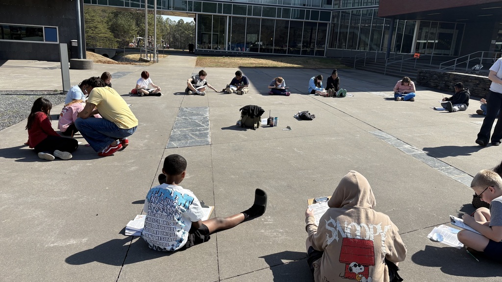 Students learning outside on a beautiful day
