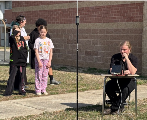 Former student William Payne speaking at BCMS
