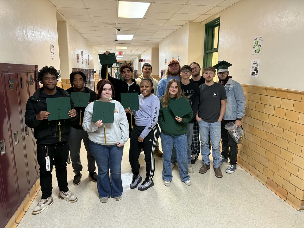 Seniors with their newly received graduation caps