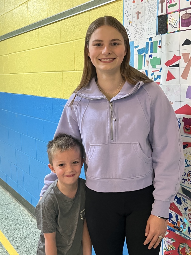 FFA  Member poses for a picture with Preschool student