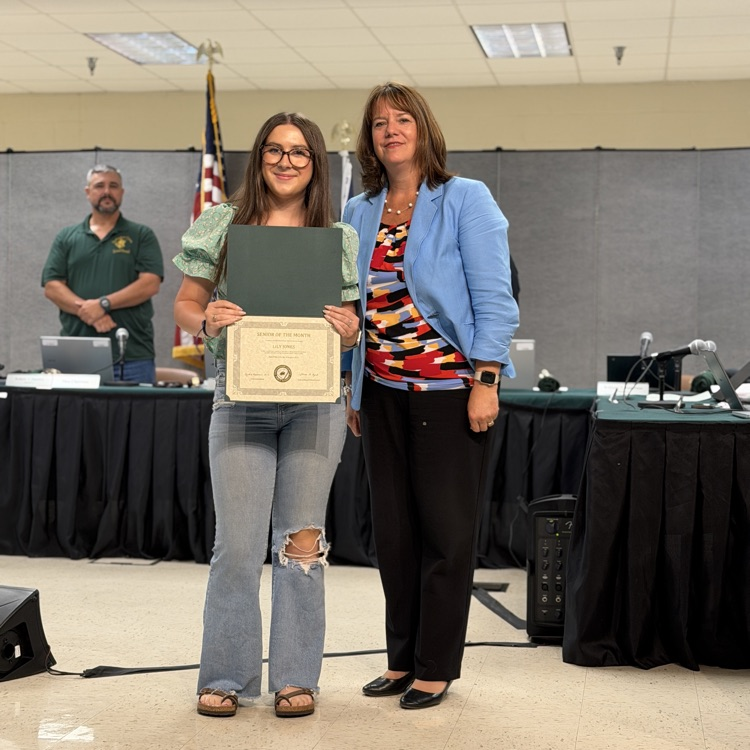 August Senior of the month Lily Jones and superintendent Dr. Reasoner