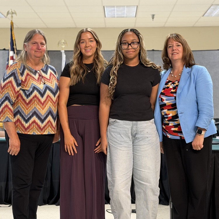 recognition of school board student liaisons Nikayshia Bolden and Ava Taylor with board chair Theresa Bryant and superintendent Dr. Reasoner