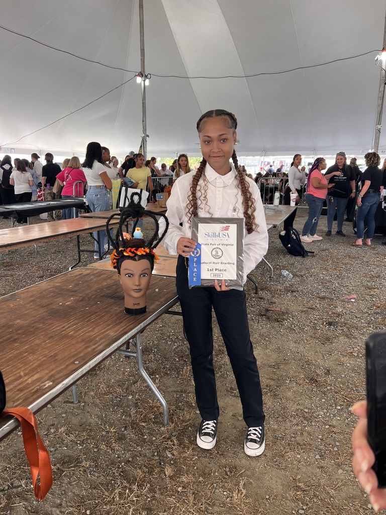 Amaura Dibble with her First Place Ribbon and Plaque and her winning braided hair
