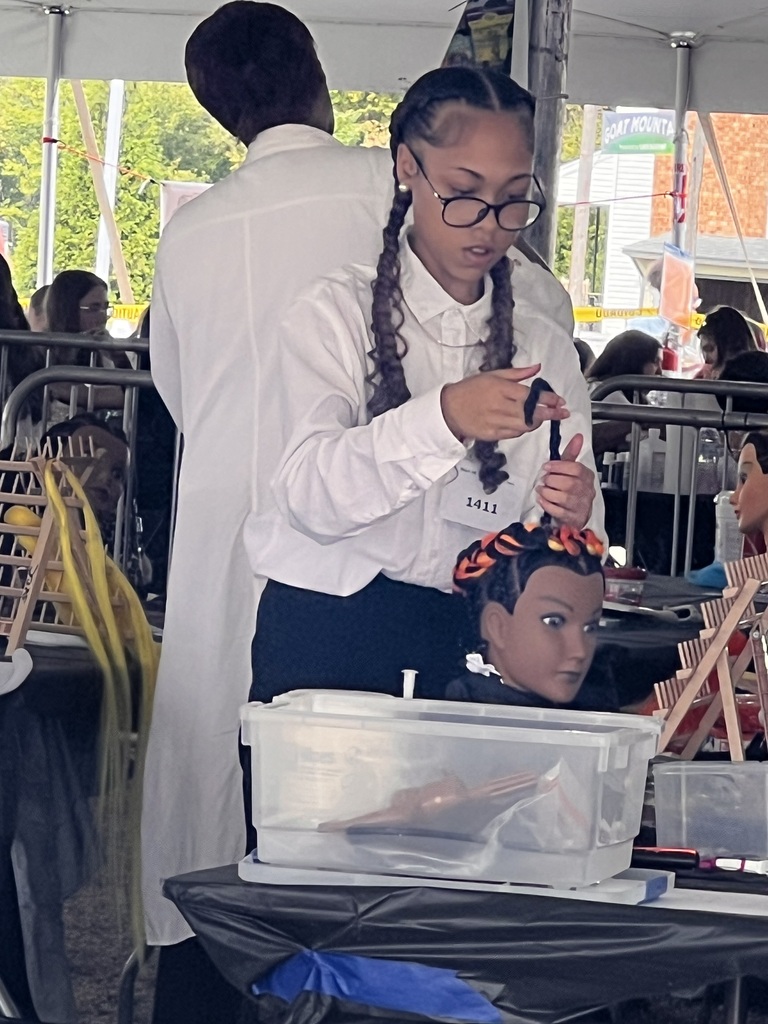 Omauria working on her braids for the competition