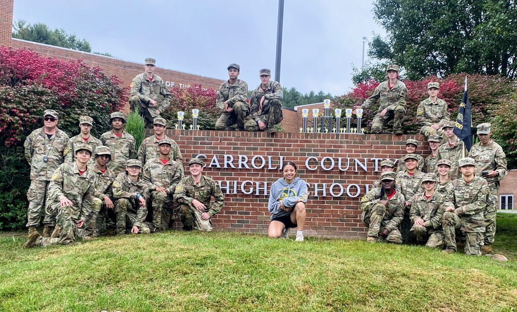 JROTC Raiders Teams pose in front of the Carroll County High School