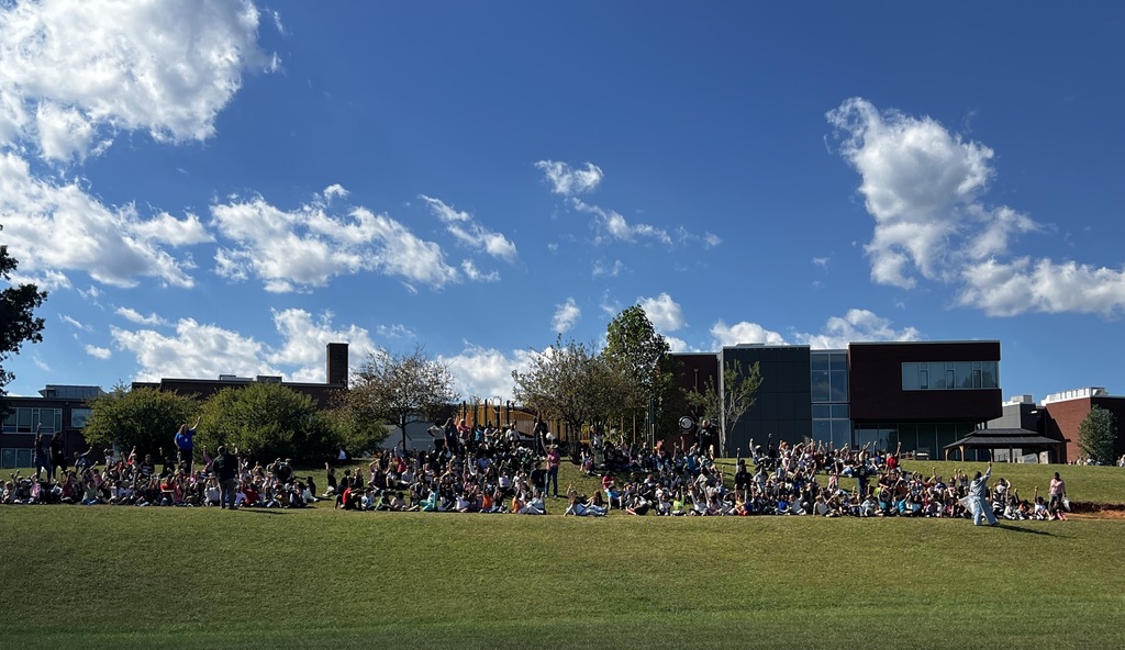Buckingham Elementary students enjoying the Crunch Heard Round the World on the back hillside of the school.