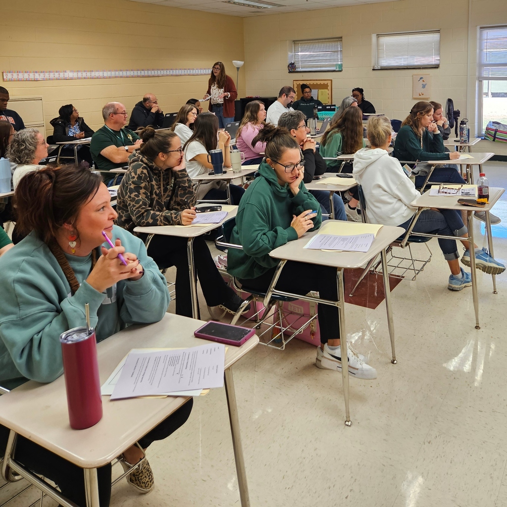 BCPS Teachers sitting  in student desks at BCMS for Professional Development Classes