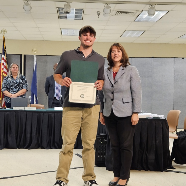 Senior of the month Trent Ragland with Superintendent Dr. Reasoner